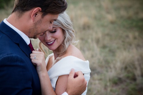 bride snuggling against groom's chest photo by Unix photography Wedding photography of bride snuggling against groom's chest photo by Unix photography